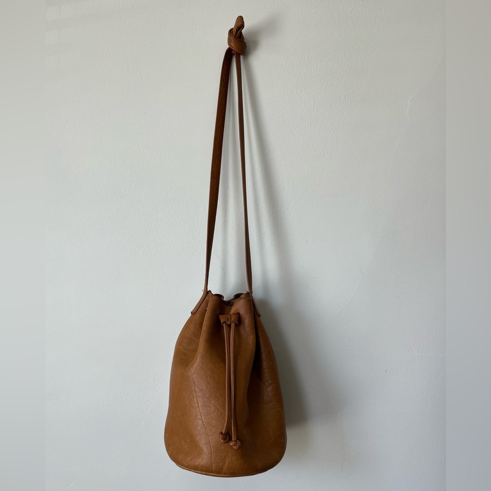 Baggu caramel colored leather handbag. Can be worn on shoulder and crossbody